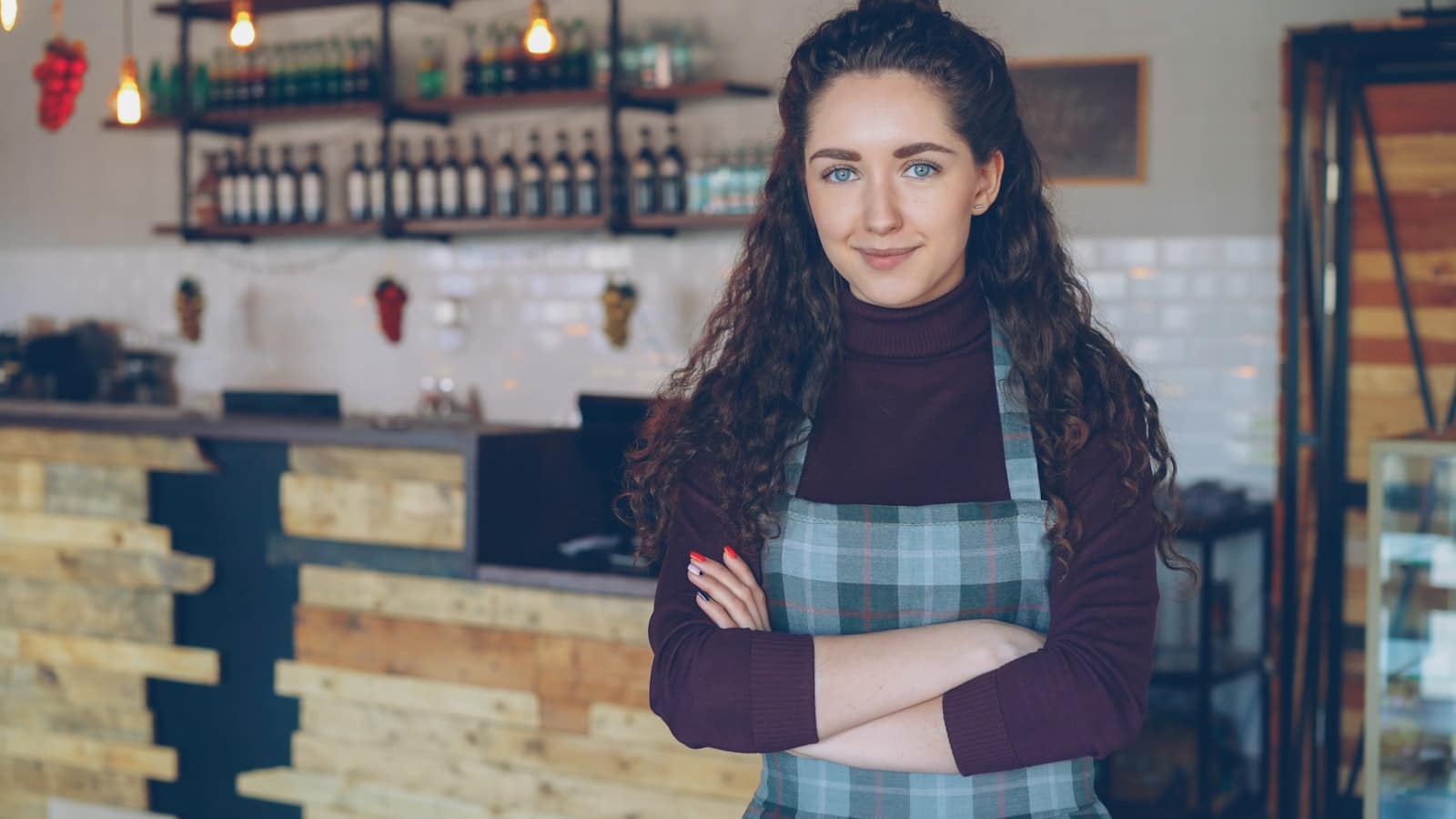 Self-employed business owner in her shop, whose mortgage income is calculated from her tax return
